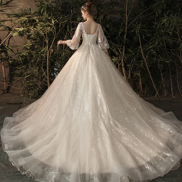 Bling Bling Champagner Durchsichtige Brautkleider / Hochzeitskleider 2019 A Linie V-Ausschnitt Geschwollenes 3/4 Ärmel Rückenfreies Pailletten Perlenstickerei Glanz Tülle Kapelle-Schleppe Rüschen