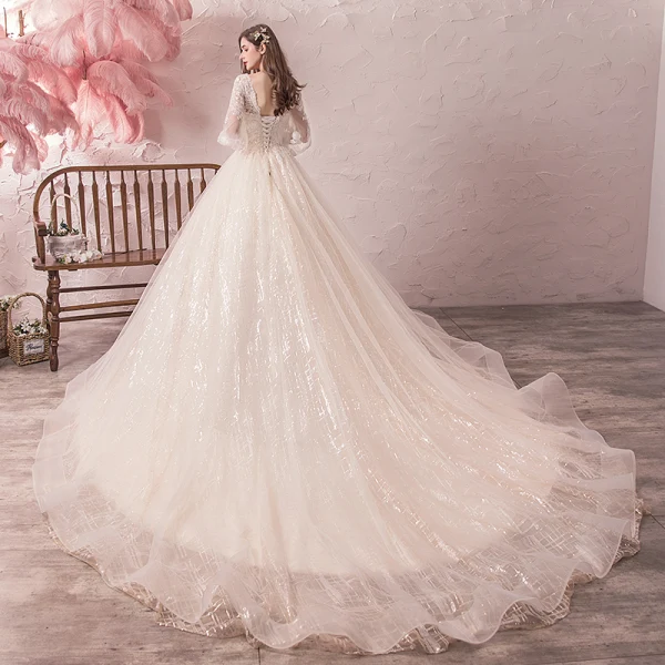 Bling Bling Champagne Robe De Mariée 2019 Princesse V-Cou Transparentes Gonflée 3/4 Manches Dos Nu Paillettes Perlage Glitter Tulle Chapel Train Volants