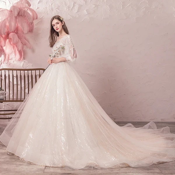 Bling Bling Champagne Robe De Mariée 2019 Princesse V-Cou Transparentes Gonflée 3/4 Manches Dos Nu Paillettes Perlage Glitter Tulle Chapel Train Volants