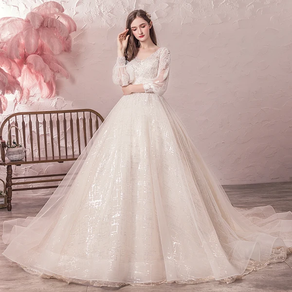 Bling Bling Champagne Robe De Mariée 2019 Princesse V-Cou Transparentes Gonflée 3/4 Manches Dos Nu Paillettes Perlage Glitter Tulle Chapel Train Volants