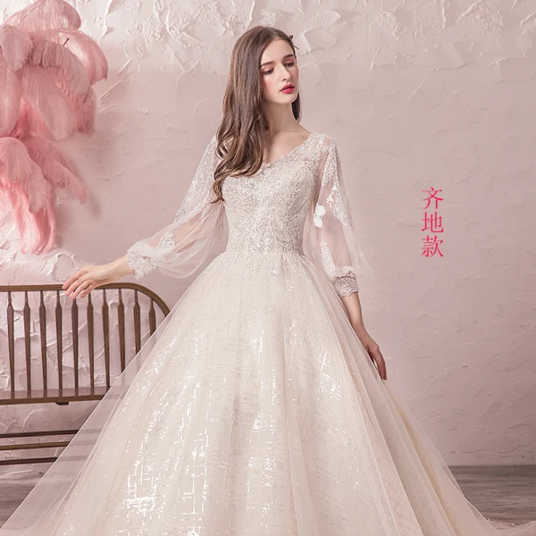 Bling Bling Champagne Robe De Mariée 2019 Princesse V-Cou Transparentes Gonflée 3/4 Manches Dos Nu Paillettes Perlage Glitter Tulle Chapel Train Volants