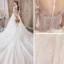 Élégant Ivoire Transparentes Robe De Mariée 2019 Princesse Encolure Dégagée Manches Courtes Perlage Gland Appliques En Dentelle Cathedral Train Volants