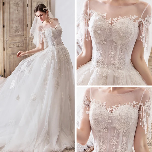 Élégant Ivoire Transparentes Robe De Mariée 2019 Princesse Encolure Dégagée Manches Courtes Perlage Gland Appliques En Dentelle Cathedral Train Volants