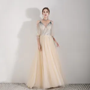 Illusion Champagne Evening Dresses 2019 A Line Princess Spaghetti Straps Puffy 3 4 Sleeve Appliques Lace Beading Floor Length Long Ruffle Backless Formal Dresses