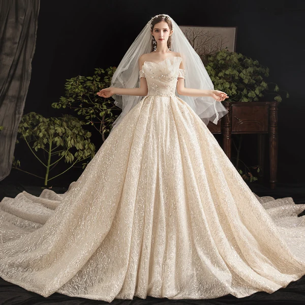 Bling Bling Champagne Wedding Dresses 2019 Ball Gown Off-The-Shoulder Short Sleeve Backless Glitter Sequins Tulle Cathedral Train Ruffle