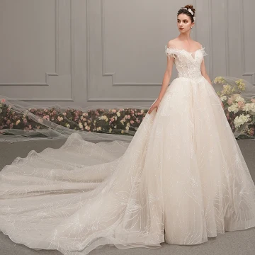 Élégant Champagne Robe De Mariée 2019 Princesse De L 039 Épaule Manches Courtes Dos Nu Perlage Appliques En Dentelle Glitter Tulle Cathedral Train Volants