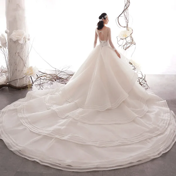 Luxus / Herrlich Champagner Durchsichtige Brautkleider / Hochzeitskleider 2019 A Linie Rundhalsausschnitt 3/4 Ärmel Rückenfreies Handgefertigt Perlenstickerei Kathedrale Schleppe Fallende Rüsche