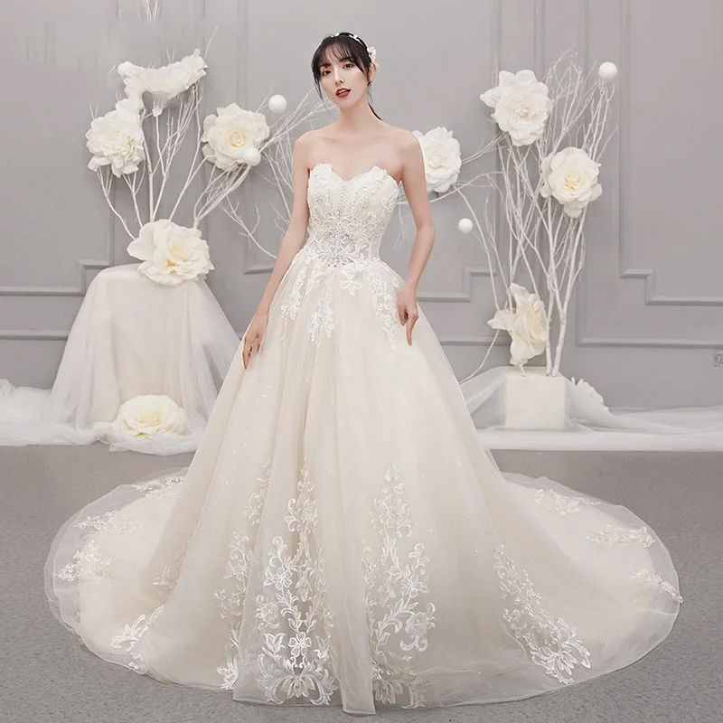 Fine Champagne Brudekjoler 2019 Prinsesse Kjæreste Uten Ermer Ryggløse Appliques Blonder Beading Glitter Tyll Chapel Train