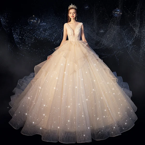 Bling Bling Champagne Wedding Dresses 2019 Ball Gown Deep V-Neck Sleeveless Backless Glitter Tulle Ruffle Cathedral Train