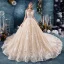 Vintage / Originale Champagne Transparentes Robe De Mariée 2019 Robe Boule Col Haut Sans Manches Dos Nu Forme de coeur Appliques En Dentelle Fait main Perlage Royal Train Volants