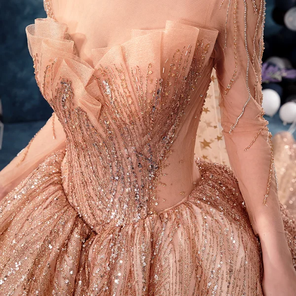 Unique Gold Durchsichtige Brautkleider / Hochzeitskleider 2019 Ballkleid Rundhalsausschnitt Lange Ärmel Rückenfreies Herzförmig Perlenstickerei Glanz Pailletten Kathedrale Schleppe Rüschen