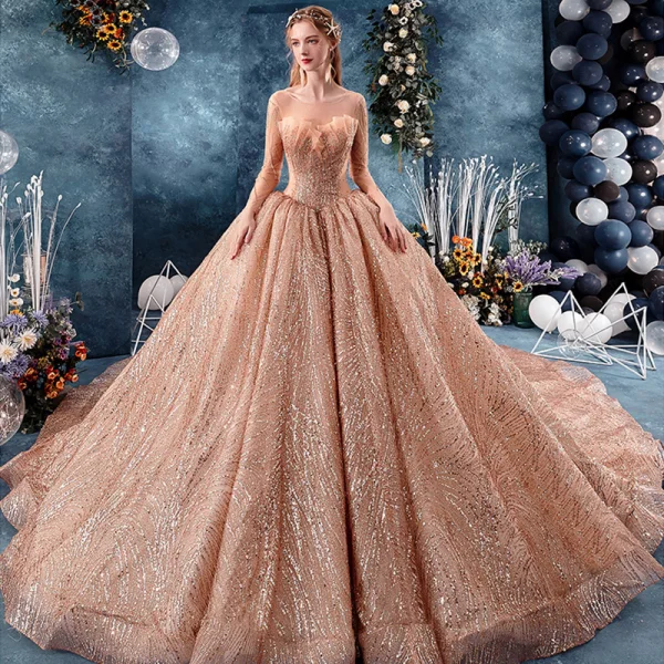 Unique Gold Durchsichtige Brautkleider / Hochzeitskleider 2019 Ballkleid Rundhalsausschnitt Lange Ärmel Rückenfreies Herzförmig Perlenstickerei Glanz Pailletten Kathedrale Schleppe Rüschen