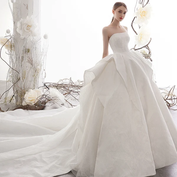 High-end Ivory Wedding Dresses 2019 Ball Gown Strapless Sleeveless Backless Glitter Tulle Cathedral Train Ruffle