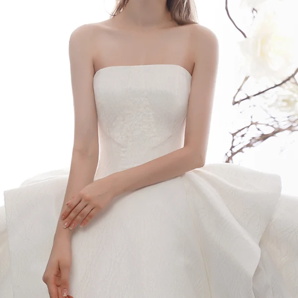 High-end Ivory Wedding Dresses 2019 Ball Gown Strapless Sleeveless Backless Glitter Tulle Cathedral Train Ruffle