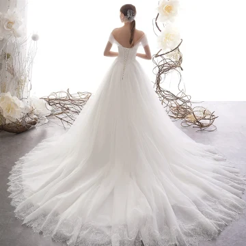 Élégant Ivoire Robe De Mariée 2019 Princesse De L 039 Épaule Manches Courtes Dos Nu Glitter Tulle Tribunal Train Volants