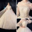 Vintage / Originale Champagne Transparentes Robe De Mariée 2019 Robe Boule Col Haut Gonflée 3/4 Manches Dos Nu Appliques En Dentelle Perlage Cathedral Train Volants