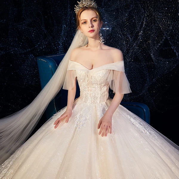 Best Champagne Wedding Dresses 2019 Ball Gown Off-The-Shoulder Short Sleeve Bell sleeves Backless Appliques Lace Beading Cathedral Train Ruffle
