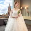 Discount Ivory Wedding Dresses 2018 Ball Gown Scoop Neck Sleeveless Backless Appliques Lace Beading Pearl Sequins Ruffle Watteau Train