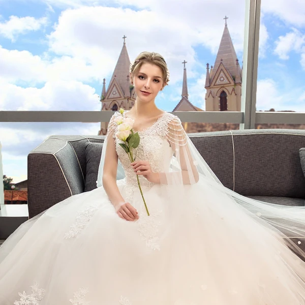 Discount Ivory Wedding Dresses 2018 Ball Gown Scoop Neck Sleeveless Backless Appliques Lace Beading Pearl Sequins Ruffle Watteau Train