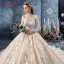 Romantisch Champagner Durchsichtige Brautkleider / Hochzeitskleider 2019 Ballkleid V-Ausschnitt Lange Ärmel Rückenfreies Applikationen Spitze Perlenstickerei Glanz Tülle Kapelle-Schleppe Rüschen