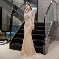 Luxe Doré Transparentes Robe De Soirée 2019 Trompette / Sirène Col Haut Sans Manches Fait main Perlage Gland Train De Balayage Robe De Ceremonie