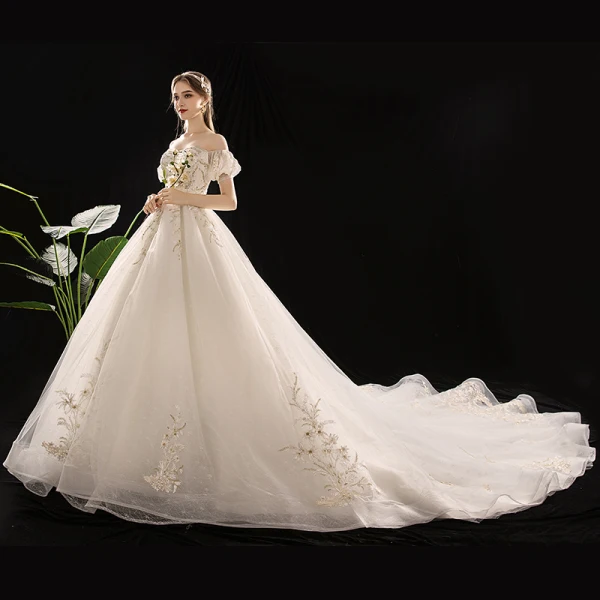Schöne Champagner Brautkleider / Hochzeitskleider 2019 A Linie Off Shoulder Geschwollenes Kurze Ärmel Rückenfreies Applikationen Spitze Pailletten Perlenstickerei Kathedrale Schleppe Rüschen