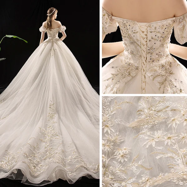 Schöne Champagner Brautkleider / Hochzeitskleider 2019 A Linie Off Shoulder Geschwollenes Kurze Ärmel Rückenfreies Applikationen Spitze Pailletten Perlenstickerei Kathedrale Schleppe Rüschen