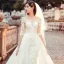 Charmant Transparentes Champagne Robe De Mariée 2019 Princesse Encolure Dégagée 1/2 Manches Dos Nu Appliques En Dentelle Chapel Train Volants