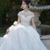Vintage / Retro Luxury / Gorgeous See-through Champagne Wedding Dresses 2019 A-Line / Princess High Neck Short Sleeve Beading Appliques Lace Glitter Tulle Cathedral Train Ruffle