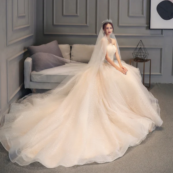 Chic / Belle Champagne Dentelle Robe De Mariée 2019 Robe Boule Bustier Sans Manches Dos Nu Glitter Tulle Appliques En Dentelle Perlage Chapel Train Volants