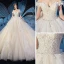 Elegant Champagne Wedding Dresses 2019 Ball Gown Off-The-Shoulder Feather Short Sleeve Backless Beading Appliques Lace Cathedral Train Ruffle