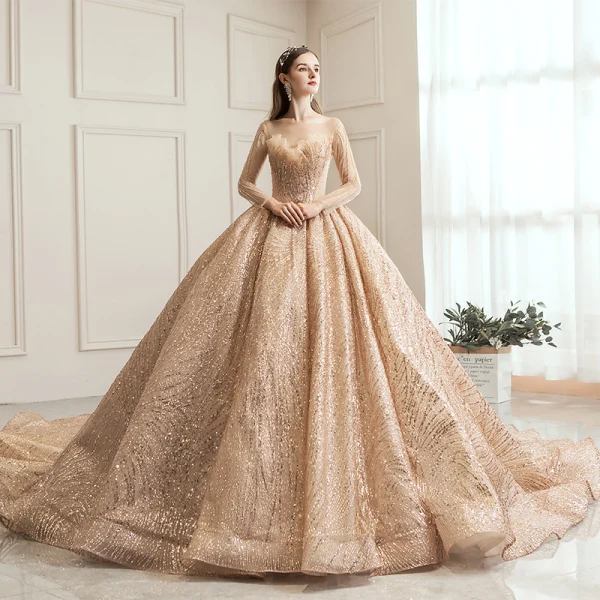 Scintillantes Champagne Transparentes Robe De Mariée 2019 Robe Boule Encolure Carrée Manches Longues Dos Nu Forme de coeur Paillettes Perlage Royal Train Volants
