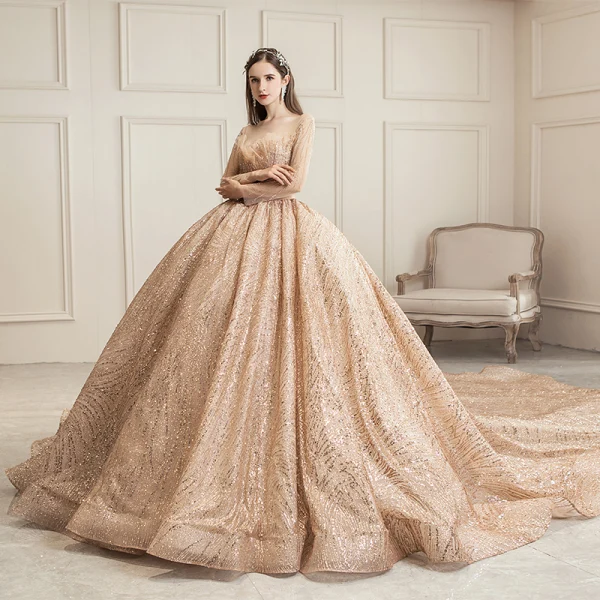 Scintillantes Champagne Transparentes Robe De Mariée 2019 Robe Boule Encolure Carrée Manches Longues Dos Nu Forme de coeur Paillettes Perlage Royal Train Volants