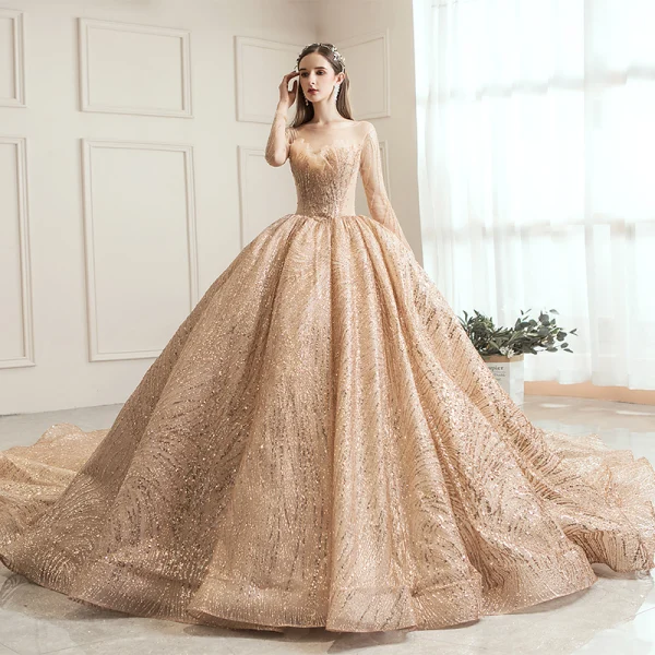 Scintillantes Champagne Transparentes Robe De Mariée 2019 Robe Boule Encolure Carrée Manches Longues Dos Nu Forme de coeur Paillettes Perlage Royal Train Volants