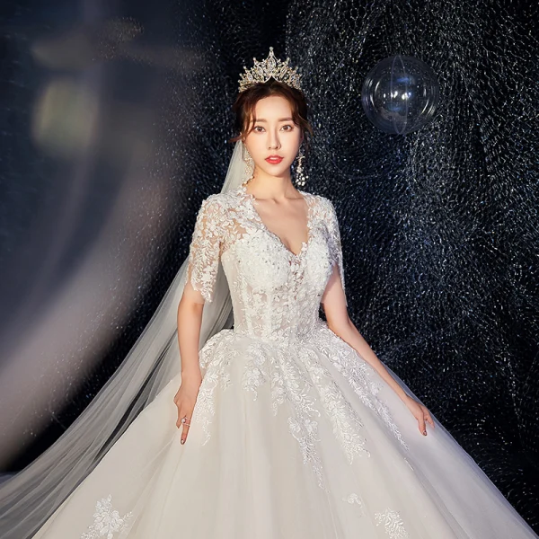 Romantic Champagne Wedding Dresses 2019 Ball Gown Deep V-Neck Short Sleeve Backless Pierced Appliques Lace Beading Cathedral Train Ruffle
