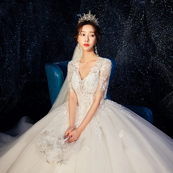 Romantic Champagne Wedding Dresses 2019 Ball Gown Deep V-Neck Short Sleeve Backless Pierced Appliques Lace Beading Cathedral Train Ruffle
