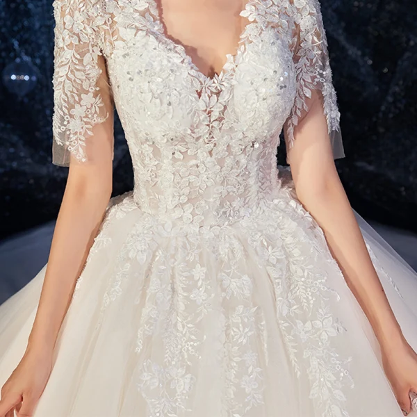 Romantic Champagne Wedding Dresses 2019 Ball Gown Deep V-Neck Short Sleeve Backless Pierced Appliques Lace Beading Cathedral Train Ruffle
