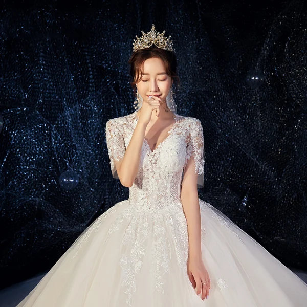 Romantic Champagne Wedding Dresses 2019 Ball Gown Deep V-Neck Short Sleeve Backless Pierced Appliques Lace Beading Cathedral Train Ruffle