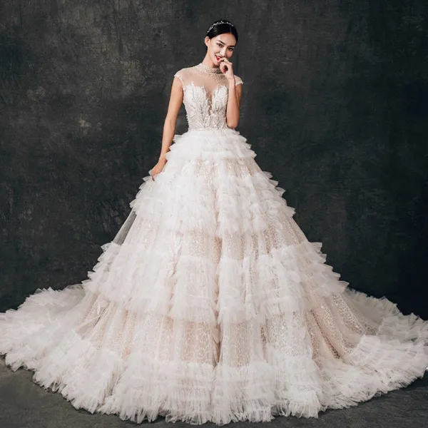 Charming See-through Champagne Lace Wedding Dresses 2019 Ball Gown High Neck Sleeveless Backless Appliques Lace Beading Cathedral Train Ruffle