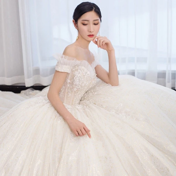 Chic / Beautiful Champagne Wedding Dresses 2019 Ball Gown Off-The-Shoulder Short Sleeve Backless Glitter Tulle Appliques Lace Beading Pearl Chapel Train Ruffle