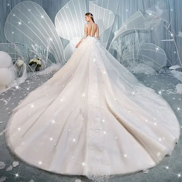 Charmant Champagne Transparentes Dos Nu Robe De Mariée 2019 Robe Boule Encolure Dégagée Manches Longues Glitter Tulle Appliques En Dentelle Perlage Cathedral Train Volants