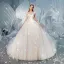 Charmant Champagne Transparentes Dos Nu Robe De Mariée 2019 Robe Boule Encolure Dégagée Manches Longues Glitter Tulle Appliques En Dentelle Perlage Cathedral Train Volants