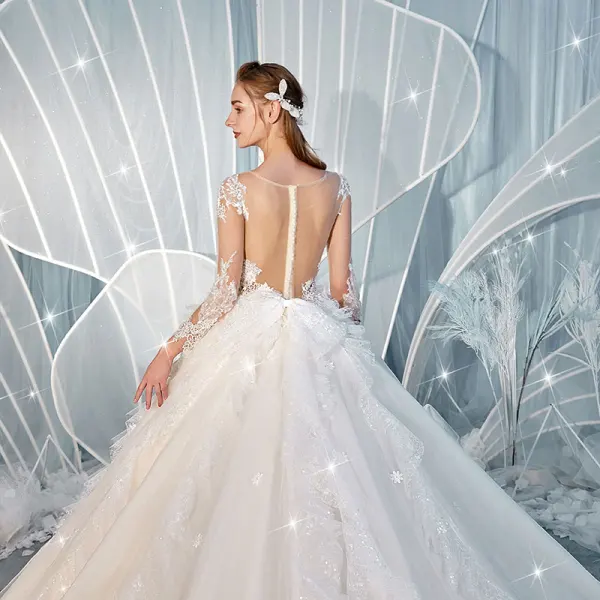 Charmant Champagne Transparentes Dos Nu Robe De Mariée 2019 Robe Boule Encolure Dégagée Manches Longues Glitter Tulle Appliques En Dentelle Perlage Cathedral Train Volants