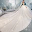 Charmant Champagne Transparentes Dos Nu Robe De Mariée 2019 Robe Boule Encolure Dégagée Manches Longues Glitter Tulle Appliques En Dentelle Perlage Cathedral Train Volants
