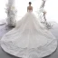 Étourdissant Ivoire Transparentes Étoile Robe De Mariée 2020 Robe Boule Col Haut Manches Longues Dos Nu Glitter Tulle Fait main Perlage Cathedral Train Volants