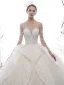 Étourdissant Ivoire Transparentes Étoile Robe De Mariée 2020 Robe Boule Col Haut Manches Longues Dos Nu Glitter Tulle Fait main Perlage Cathedral Train Volants