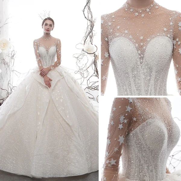 Étourdissant Ivoire Transparentes Étoile Robe De Mariée 2020 Robe Boule Col Haut Manches Longues Dos Nu Glitter Tulle Fait main Perlage Cathedral Train Volants
