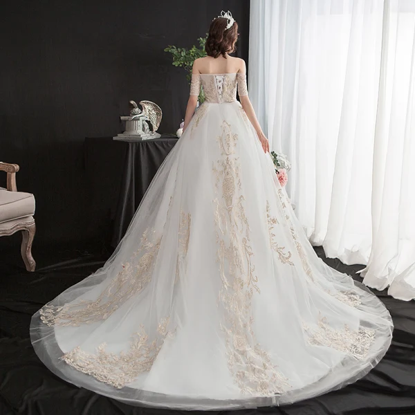 Abordable Ivoire Robe De Mariée 2020 Princesse De l'épaule Manches Courtes Dos Nu Glitter Appliques En Dentelle Chapel Train Volants