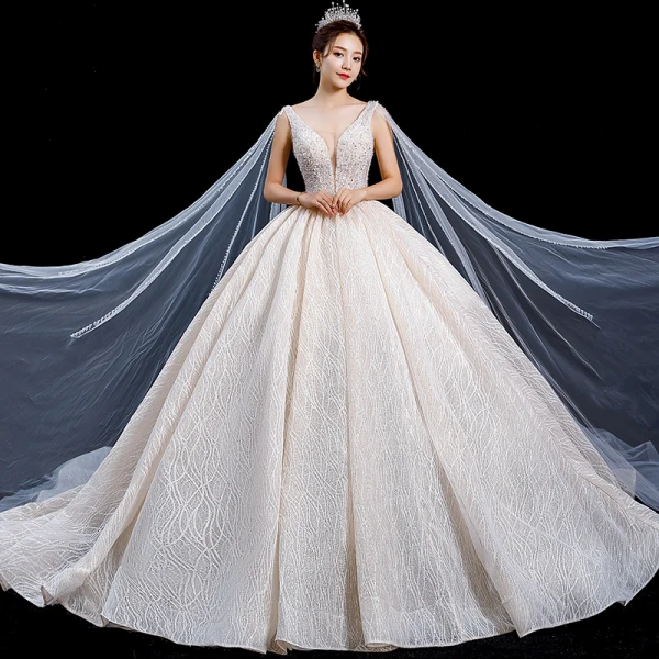 High-end Champagne Wedding Dresses 2020 Ball Gown Deep V-Neck Sleeveless Backless Appliques Lace Sequins Beading Watteau Train Ruffle