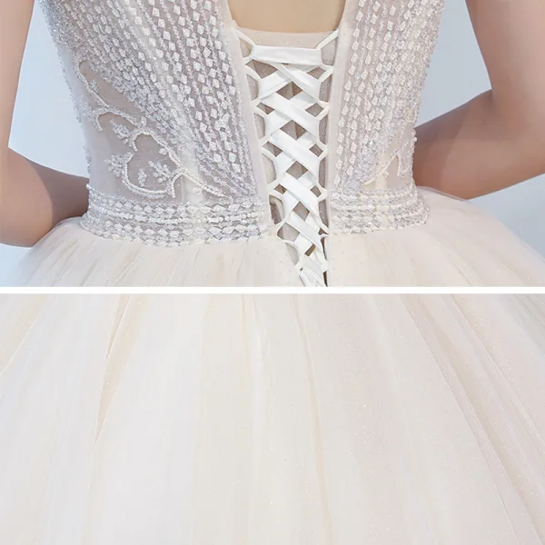 Charmant Champagner Durchsichtige Brautkleider / Hochzeitskleider 2020 Ballkleid Rundhalsausschnitt Ärmel Rückenfreies Perlenstickerei Glanz Tülle Kapelle-Schleppe Rüschen
